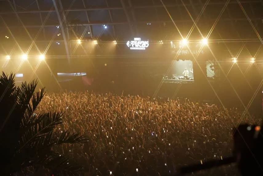 &Friends · The crowd under the festival lights.