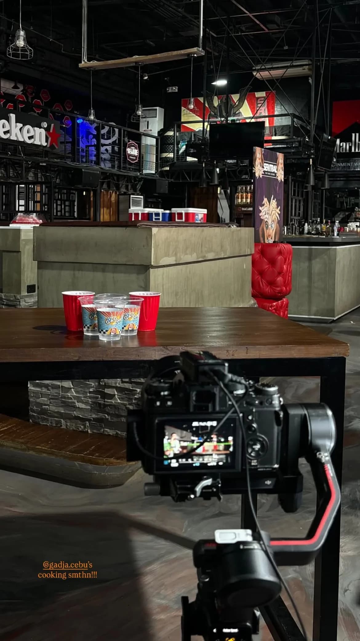 Two photographs showing an event venue and a camera on a gimbal.