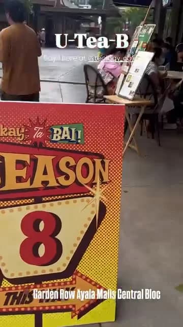 Ukay Ta Bai Season 8 signs and stalls along the Garden Row walkway.