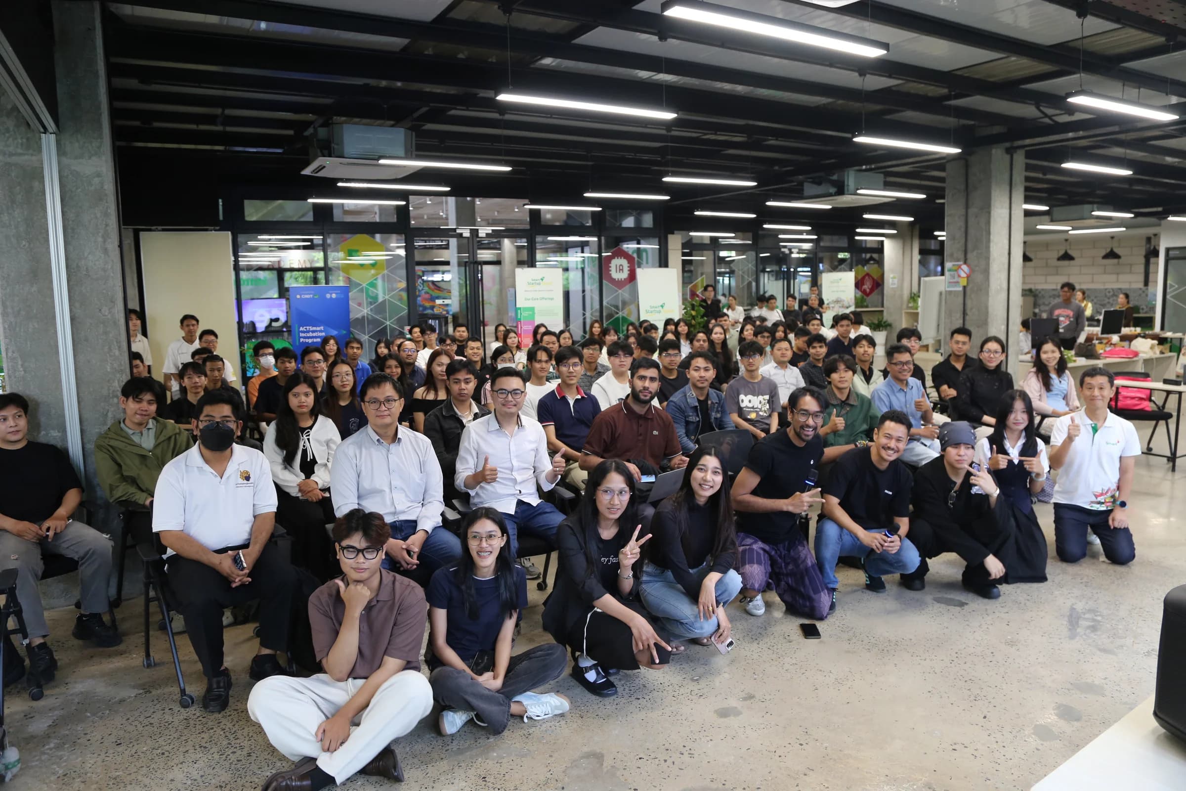 Attendees and speakers gathered for a wide group photograph at the Cambodia meetup.